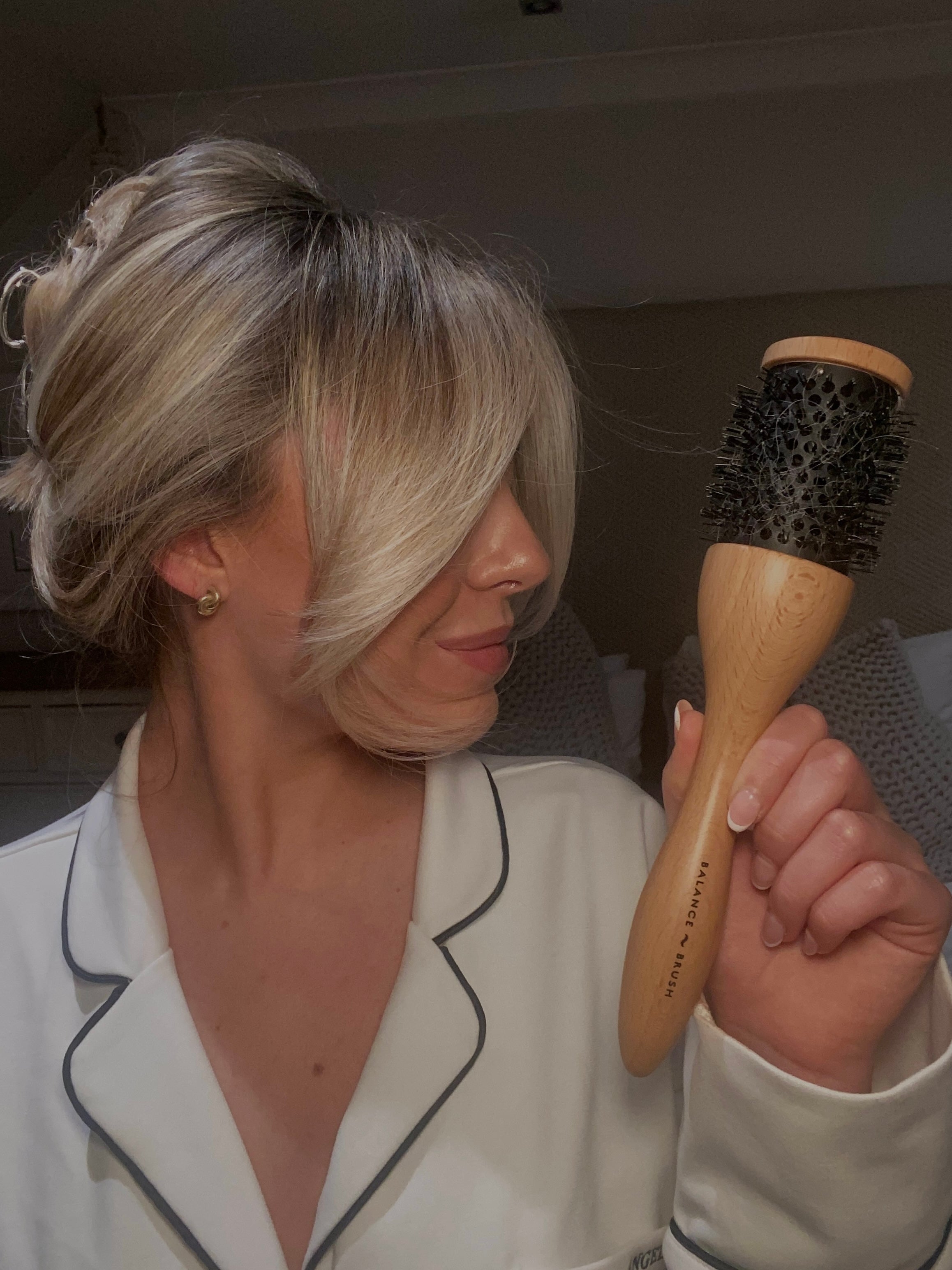 Load video: this is a video of a woman blow drying her hai with the balance brush demonstrating how the brush works